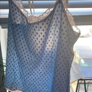 Blue mesh top with white shape wear tank attached . Fits small to large, flowy